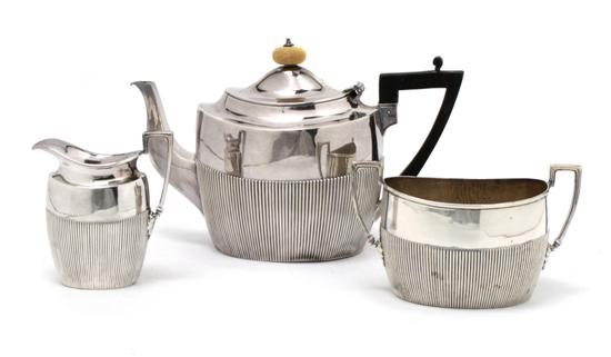 Appraisal: An English Silver Three Piece Tea Set James Dixon and