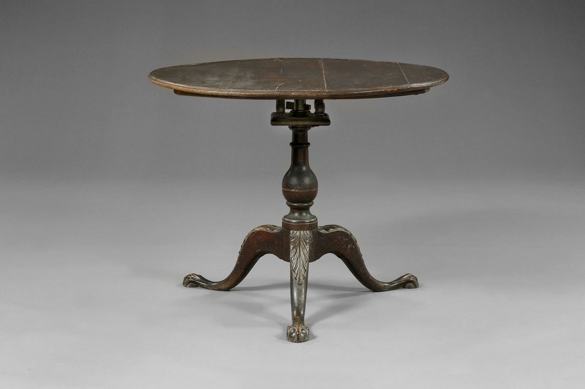 Appraisal: PENNSYLVANIA CHIPPENDALE TEA TABLE IN OLD SURFACE The dish top