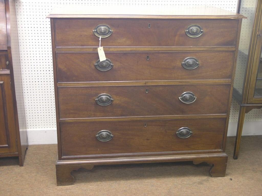 Appraisal: A George III mahogany chest four long pine-lined drawers each