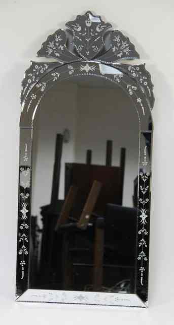 Appraisal: A modern Venetian mirror in an engraved mirrored frame cm