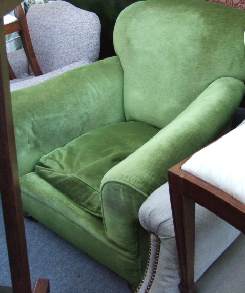 Appraisal: A th century mahogany framed green upholstered armchair on turned