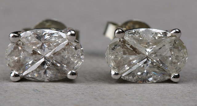 Appraisal: A PAIR OF FANCY CUT DIAMOND EAR STUDS claw set