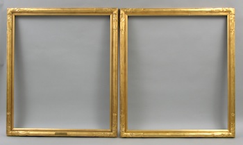 Appraisal: A Pair of Hand Carved Gilt Portrait Frames A pair