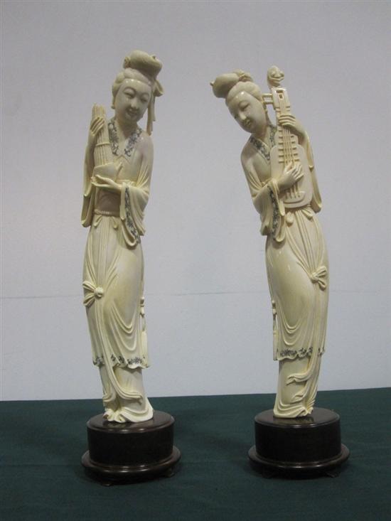 Appraisal: PAIR ORIENTAL CARVED IVORY FIGURES A lady holding a lute