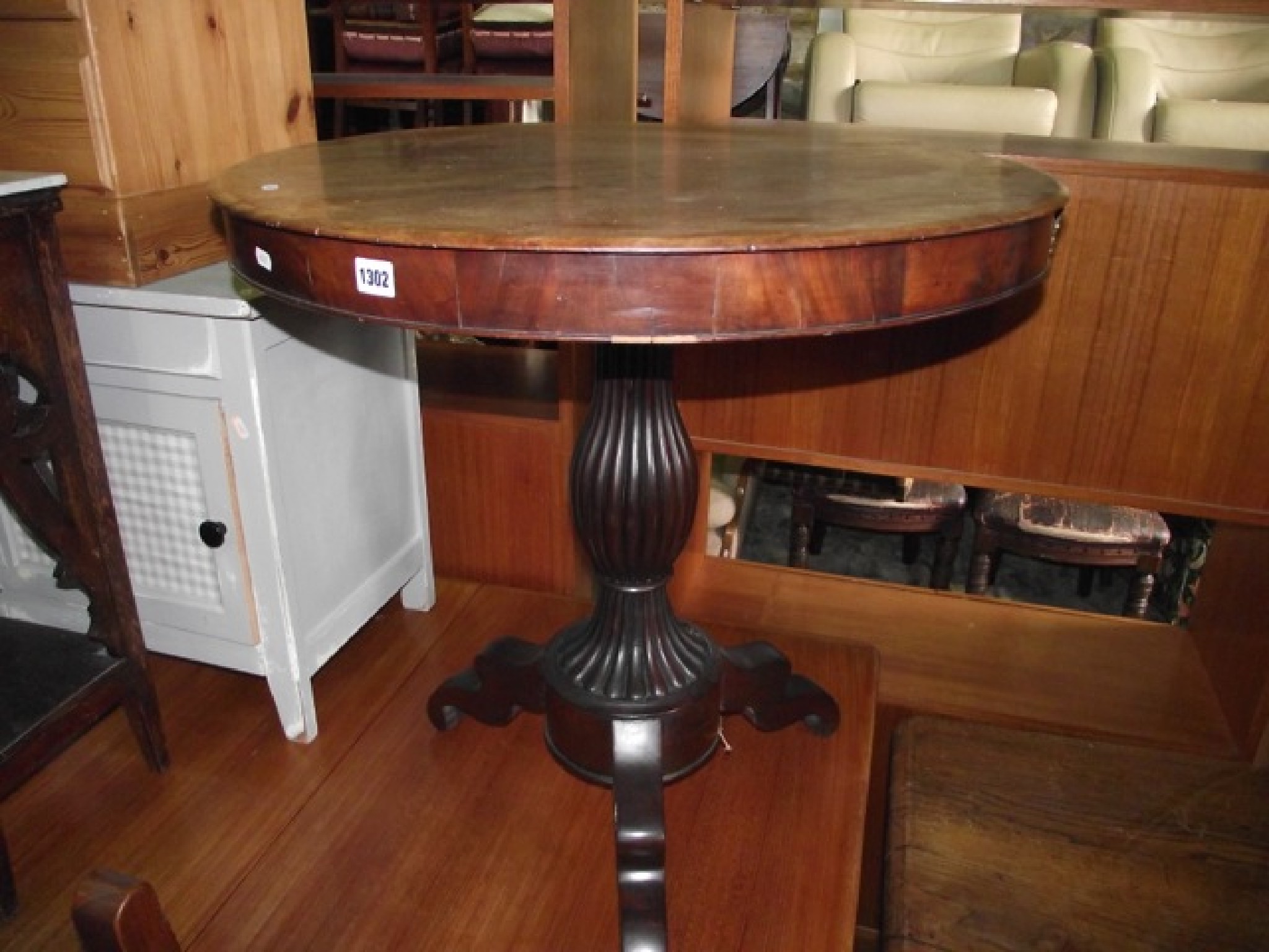 Appraisal: A th century mahogany occasional table of circular form raised