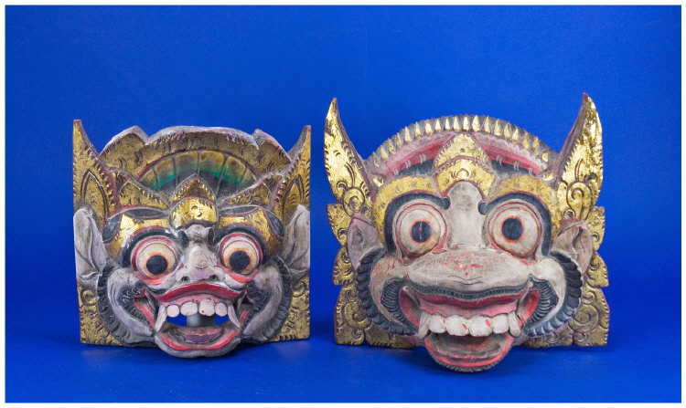 Appraisal: Two Balinese Painted Wall Masks Coloured Dragon Heads Gilt Highlights