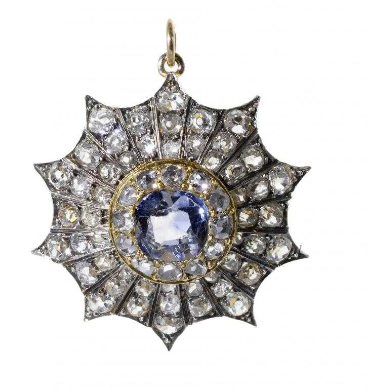 Appraisal: A SAPPHIRE AND DIAMOND PENDANT of star shape the larger