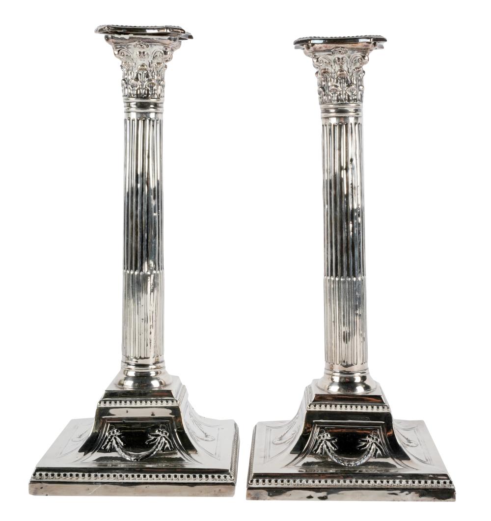 Appraisal: PAIR OF SILVER-PLATE COLUMNAR CANDLESTICKSunmarked each weighted Provenance The E