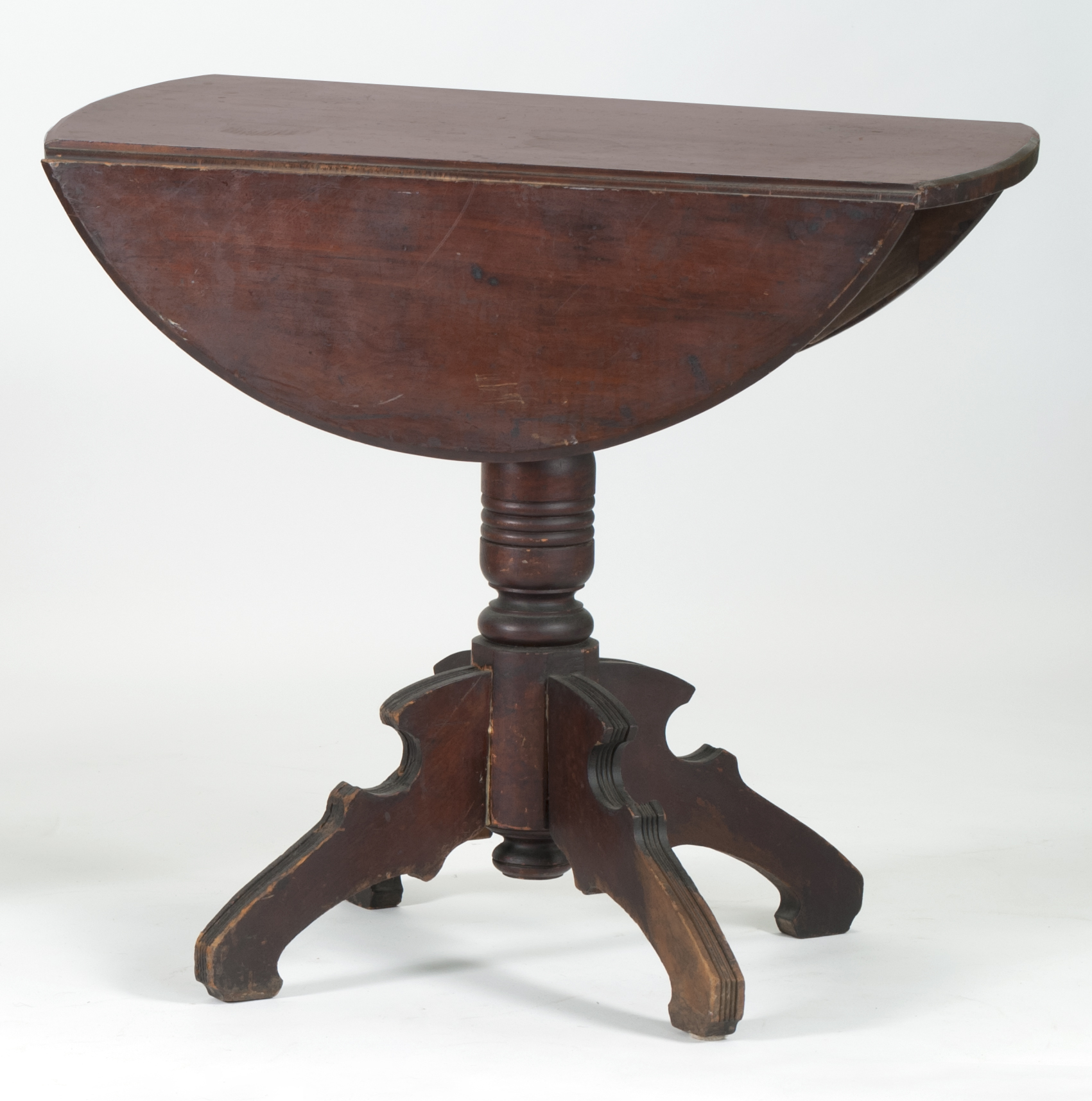 Appraisal: MID- TH CENTURY AMERICAN DROP-LEAF TABLE in walnut Pedestal base