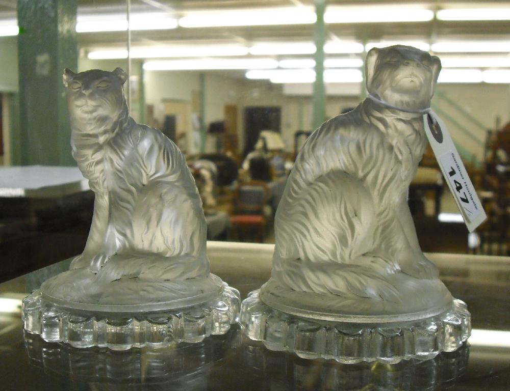 Appraisal: Pair of moulded and frosted glass figures of a seated