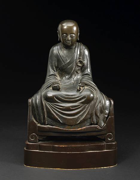 Appraisal: A cast bronze seated figure of a luohan th th