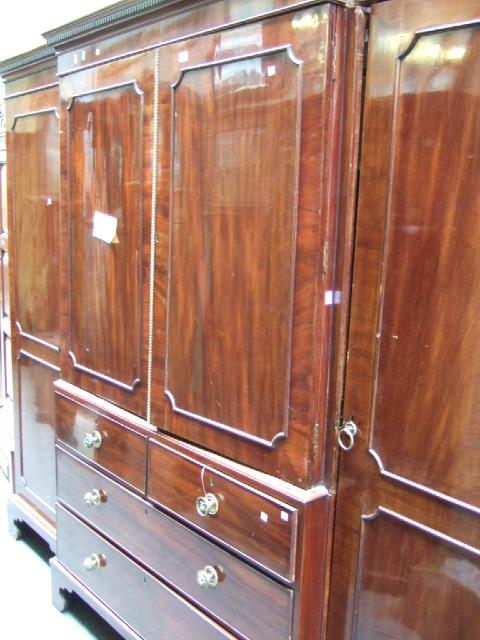 Appraisal: A th century mahogany compactum wardrobe the dentil cornice over