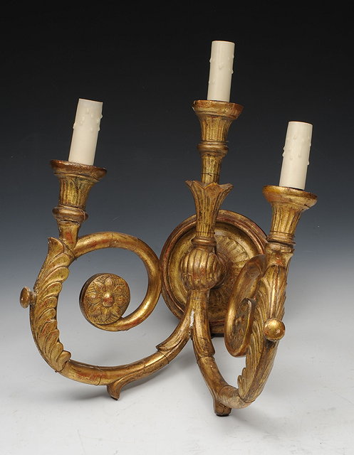 Appraisal: A PAIR OF FRENCH CARVED GILTWOOD EMPIRE STYLE WALL LIGHTS