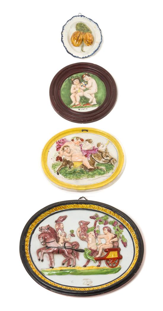 Appraisal: Sale Lot Four Ceramic Wall Plaques th th century comprising