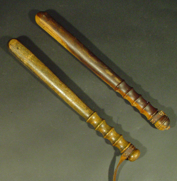 Appraisal: Two Victorian wooden truncheons with leather straps each cm in