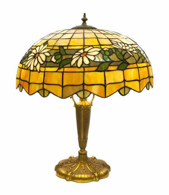 Appraisal: An American Leaded Glass Lamp the foliate decorated domed shade