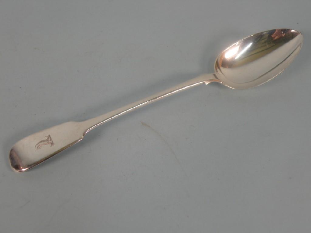 Appraisal: A silver fiddle pattern serving spoon London hallmark and date