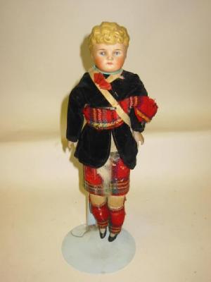 Appraisal: A parian shoulder head boy doll with painted face and