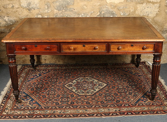 Appraisal: A GEORGE IV MAHOGANY RECTANGULAR DOUBLE SIDED LIBRARY TABLE with