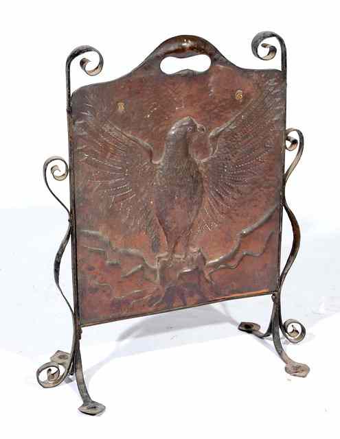 Appraisal: AN ART NOUVEAU COPPER AND IRON FIRE SCREEN the central