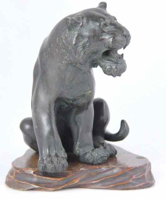 Appraisal: A Japanese bronze of a sitting tiger circa