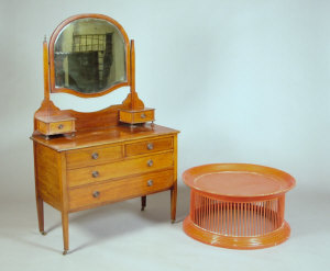 Appraisal: An Edwardian mahogany and inlaid dressing chest the bevelled oval