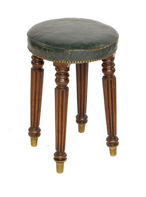 Appraisal: A George IV circular stool the brass studded leather covered