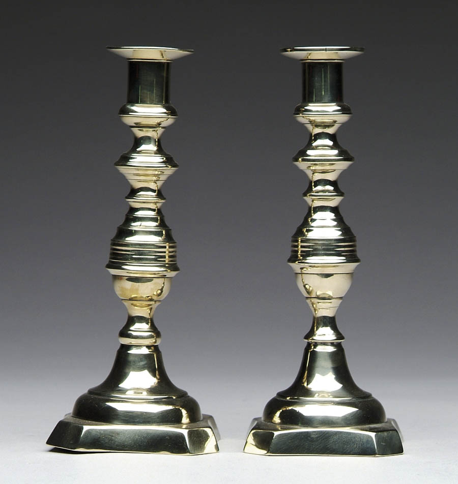 Appraisal: FINE PAIR OF BRASS CANDLESTICKS Baluster form with shaped square