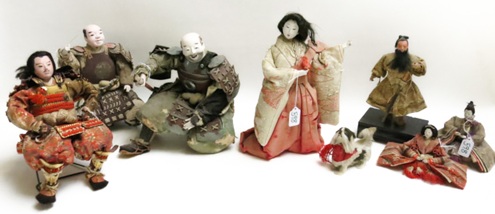 Appraisal: SEVEN JAPANESE CLOTH DOLLS depicting Samurai warriors and Geisha girls