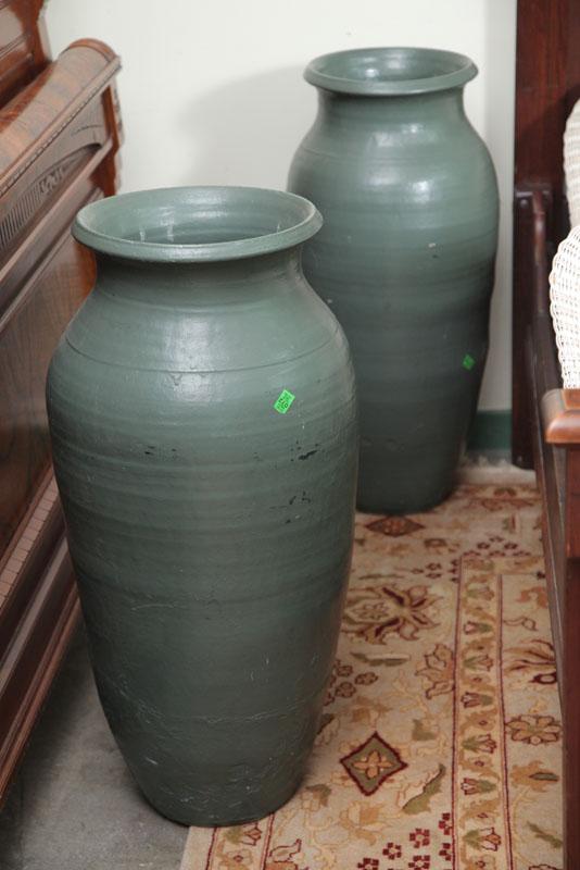 Appraisal: TWO LARGE URNS Green semi matte glaze with flared rims