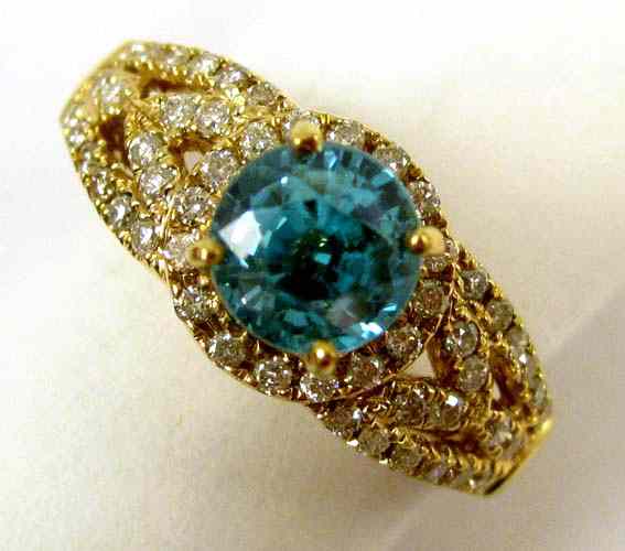 Appraisal: ZIRCON DIAMOND AND FOURTEEN KARAT GOLD RING featuring a round-cut