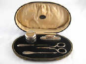 Appraisal: A boxed silver mounted manicure set hallmarked Birmingham -