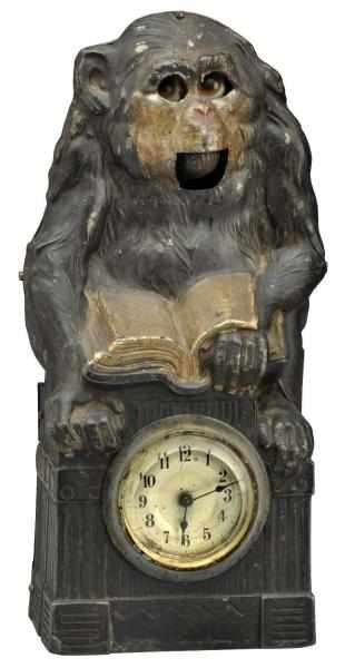 Appraisal: Tin Metal Monkey Reading Clock Circa Key-wound Monkey's eyes and