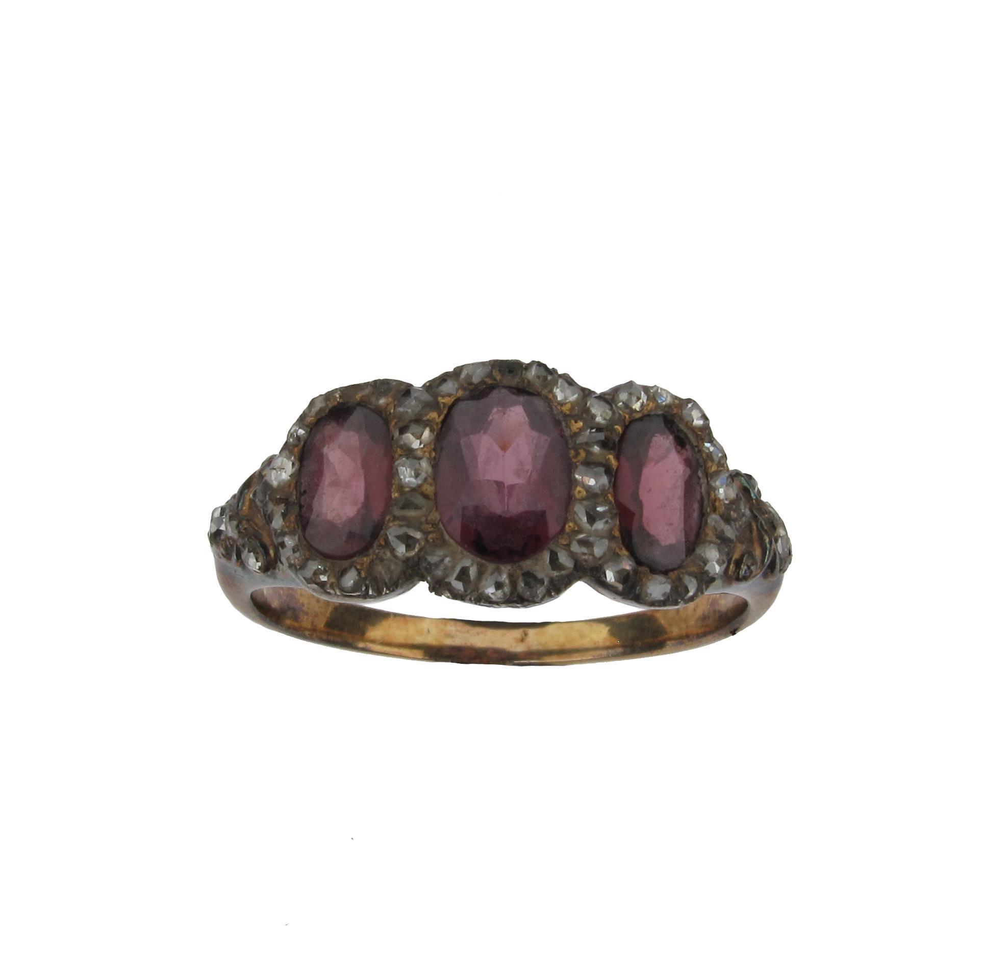 Appraisal: A garnet and diamond triple cluster ring