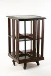 Appraisal: BOOKCASE - Circa mahogany two tier revolving bookcase with slat