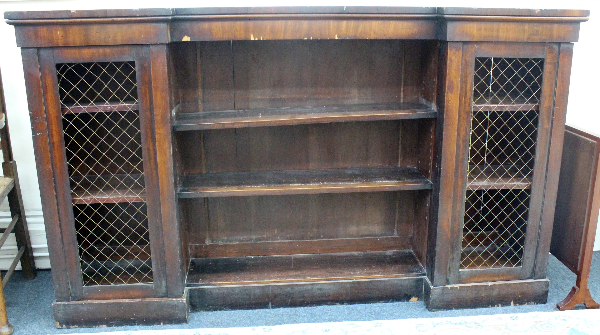 Appraisal: An early Victorian mahogany dwarf inverted breakfront bookcase the central