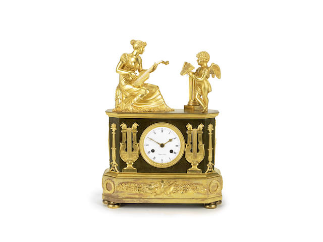 Appraisal: An Empire gilt and patinated bronze figural mantel clock the