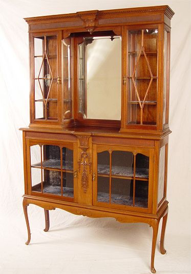 Appraisal: ENGLISH WALNUT CURIO SIDE CABINET Velvet lined shelves protect glassware