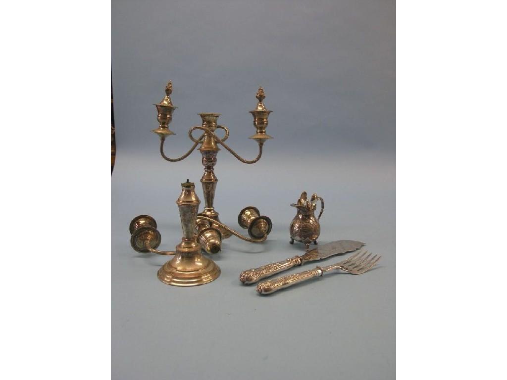 Appraisal: A pair of silver plated candelabra one stem damaged together