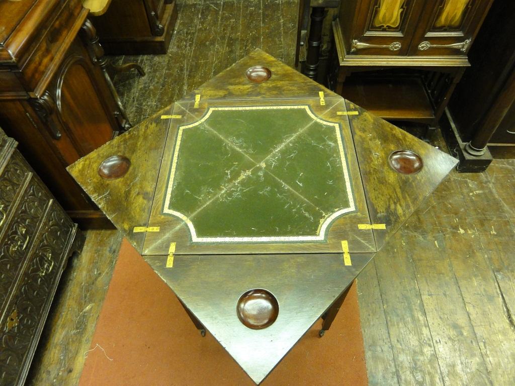 Appraisal: An inlaid Edwardian rosewood envelope card table with box wood