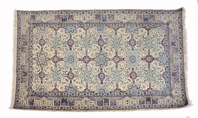 Appraisal: A PERSIAN PATTERN WHITE GROUND RUG decorated stylised medallions within