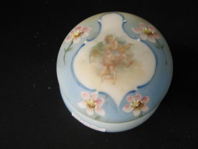 Appraisal: Nakara Victorian Art Glass Dresser Box cherub decor blue satin