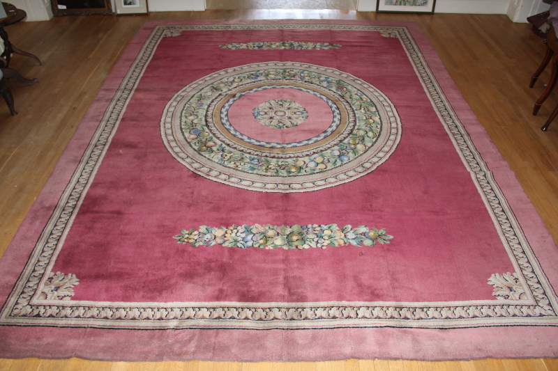 Appraisal: An Axminster pink ground Empire design carpet with central foliate