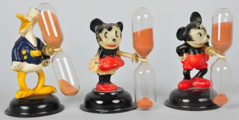 Appraisal: Lot of Celluloid Disney Character Egg Timers Description English Circa