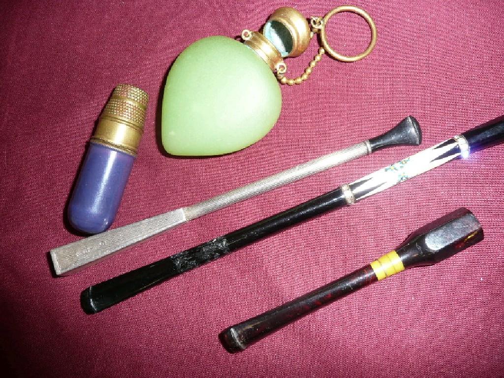 Appraisal: Vintage cigarette holders various styles a vintage green glass perfume