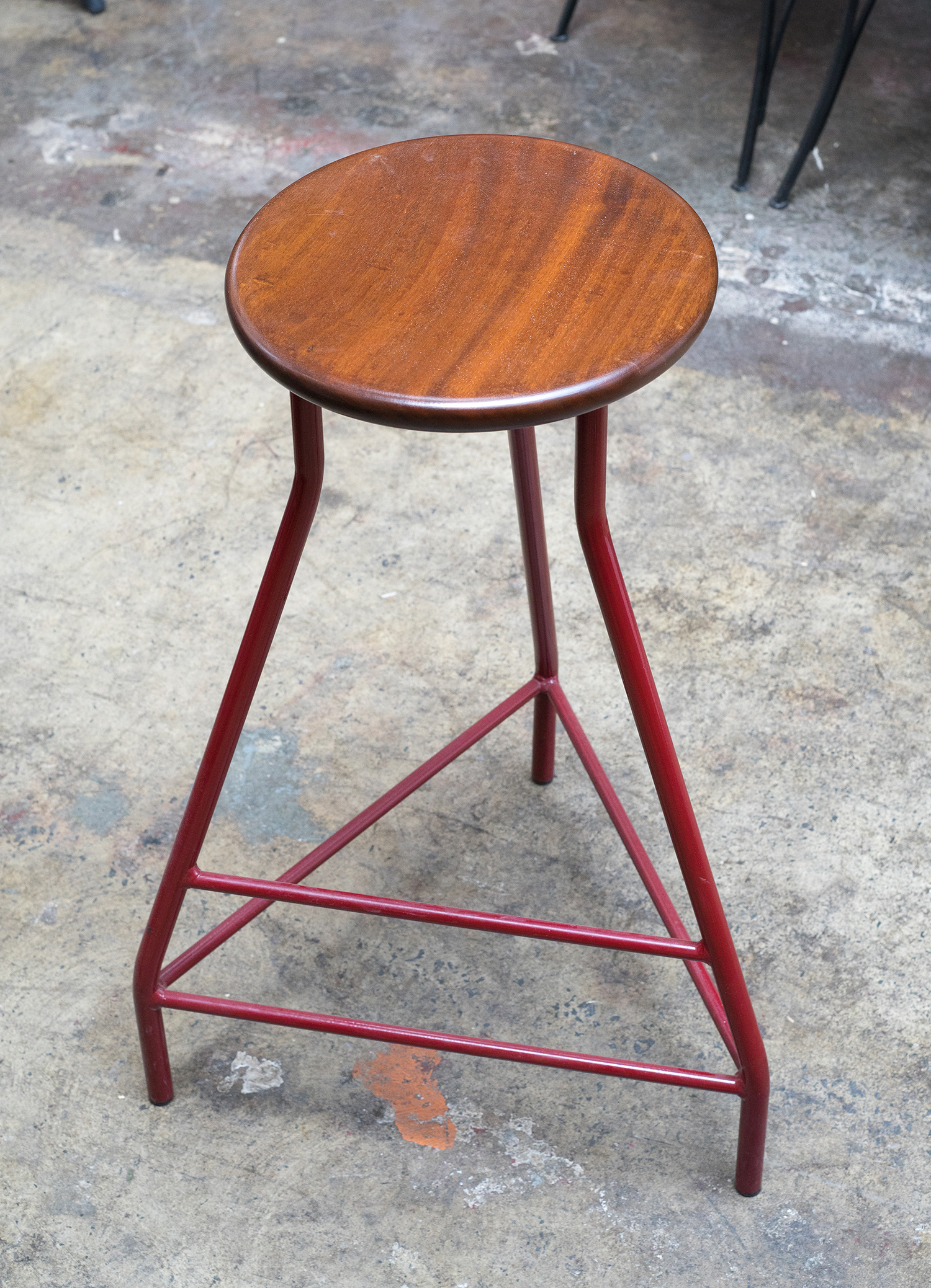 Appraisal: THREE CONTEMPORARY STOOLS ON TRIPOD BASE Powder coated in orange