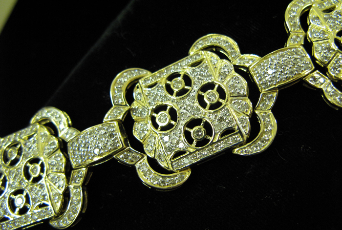 Appraisal: A DIAMOND AND FOURTEEN KARAT GOLD BRACELET WITH APPRAISAL The