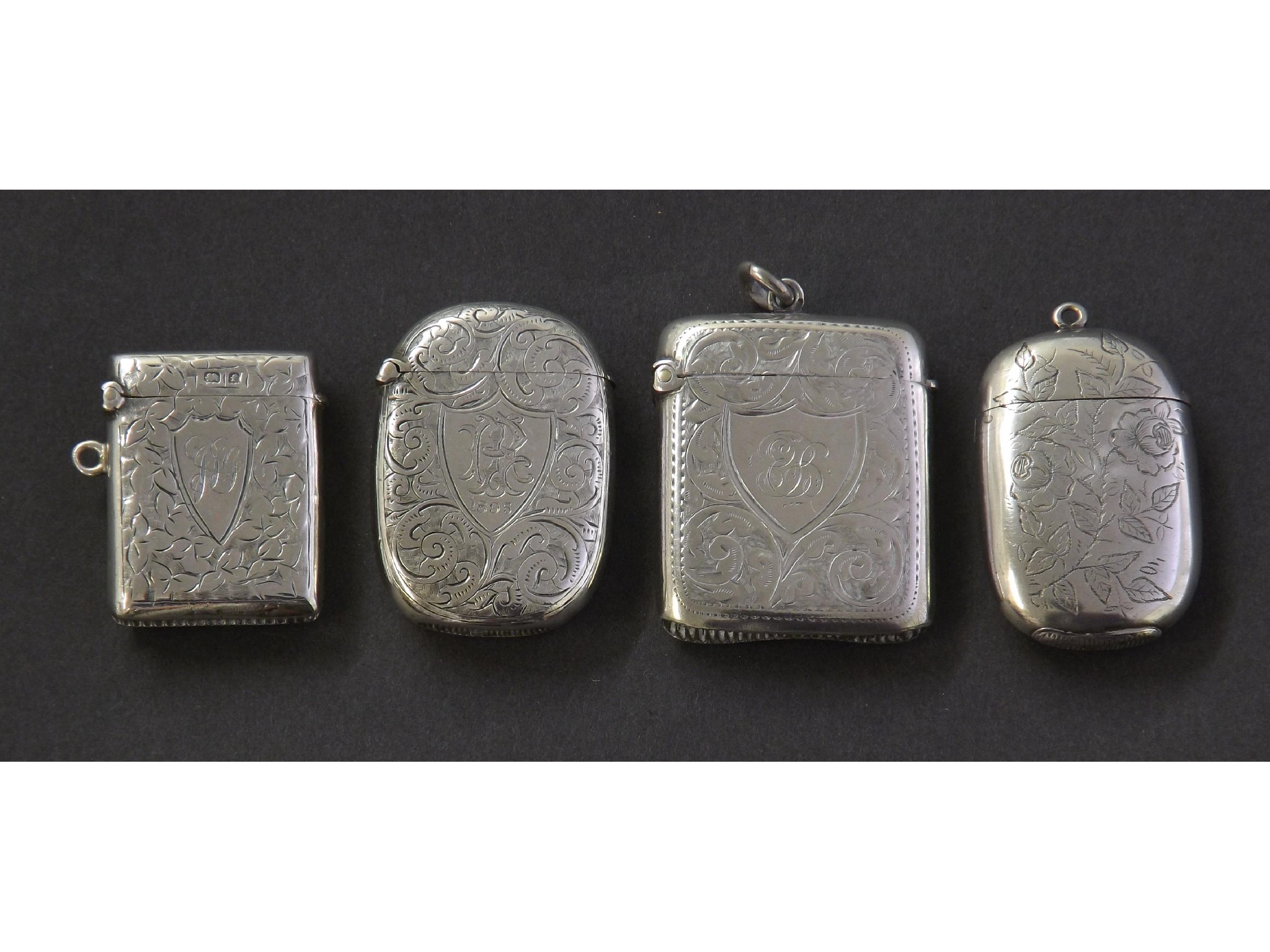 Appraisal: Four th century and later silver vesta cases each engraved