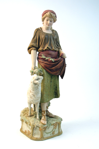 Appraisal: ROYAL DUX POTTERY FIGURE of a young woman with apron