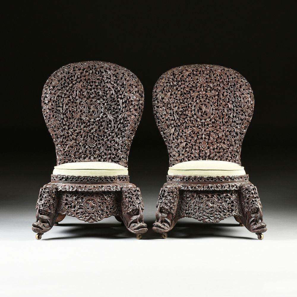 Appraisal: A PAIR OF ANGLO INDIAN BOMBAY BLACKWOOD FILIGREE SLIPPER CHAIRS